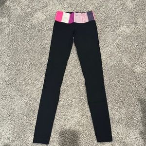 Lululemon leggings with colorful waistband.